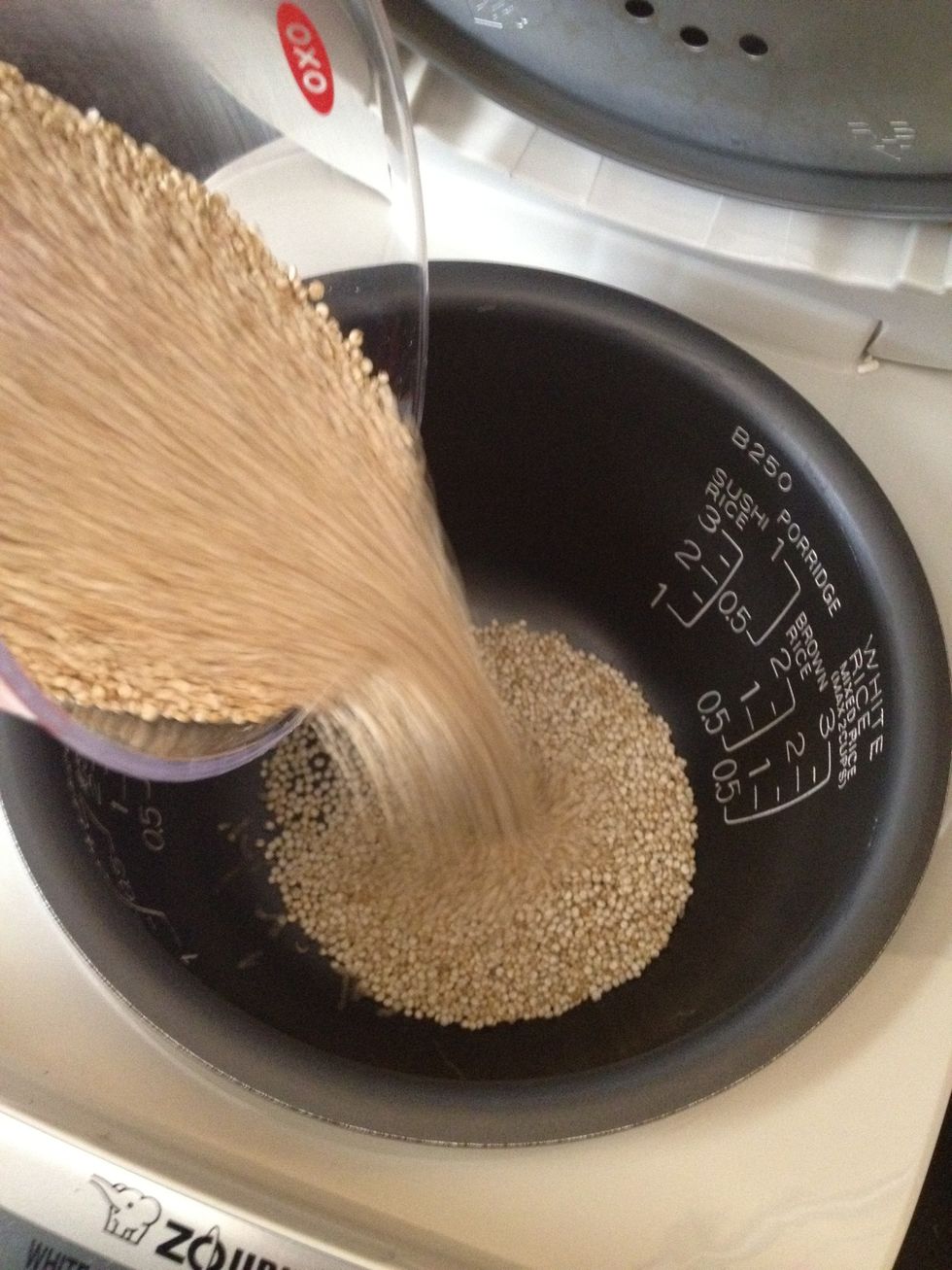 Pour quinoa into rice cooker