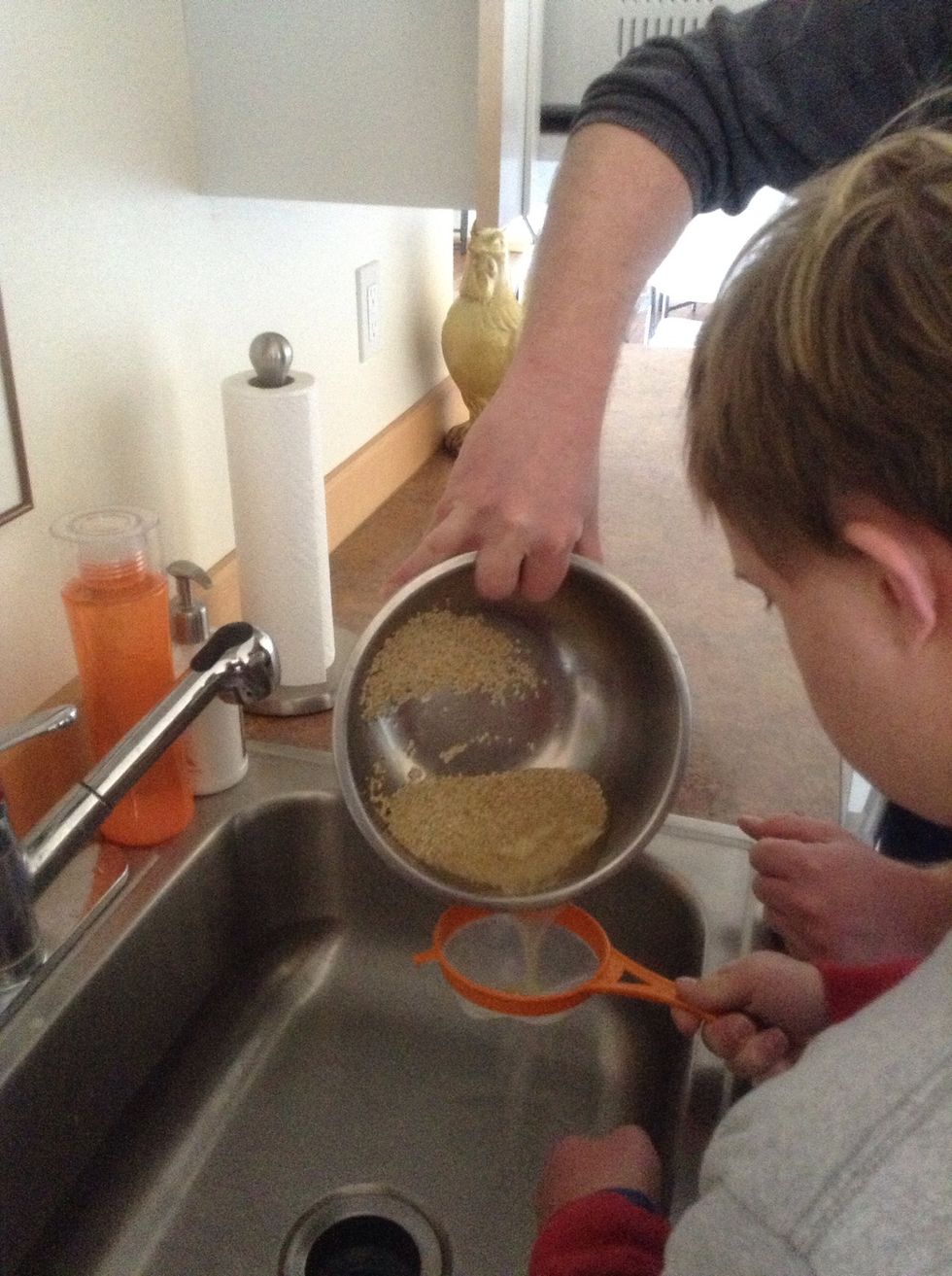 Pour quinoa through strainer