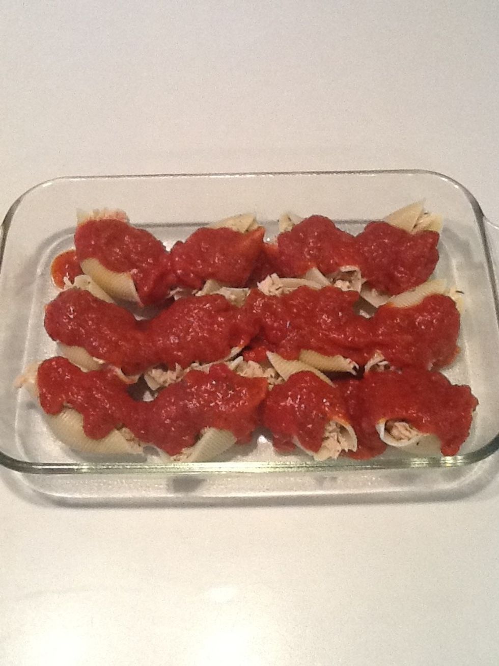 Pour sauce over pasta shells.