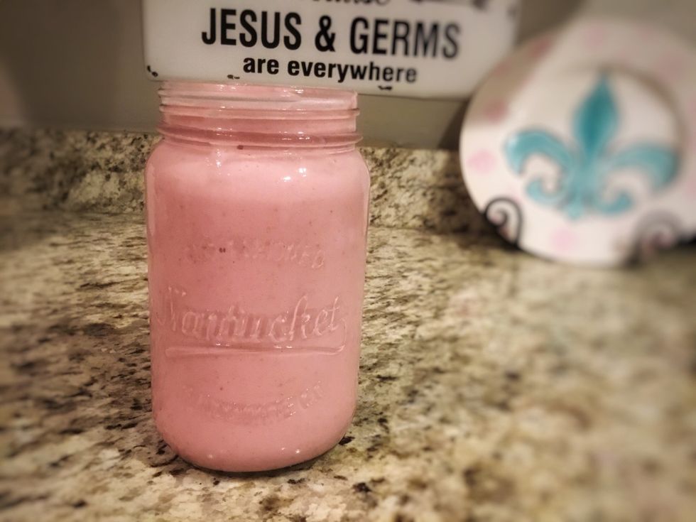 Pour smoothie into glass