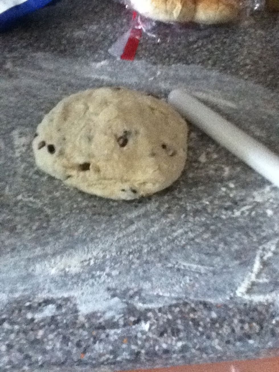Pour some flour on the side and start to roll out the dough