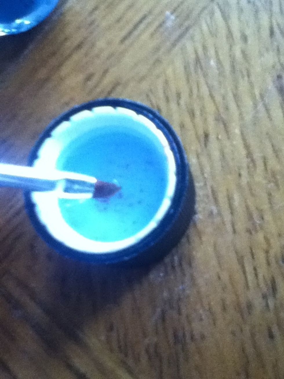 Pour some in cap and dip brush in it