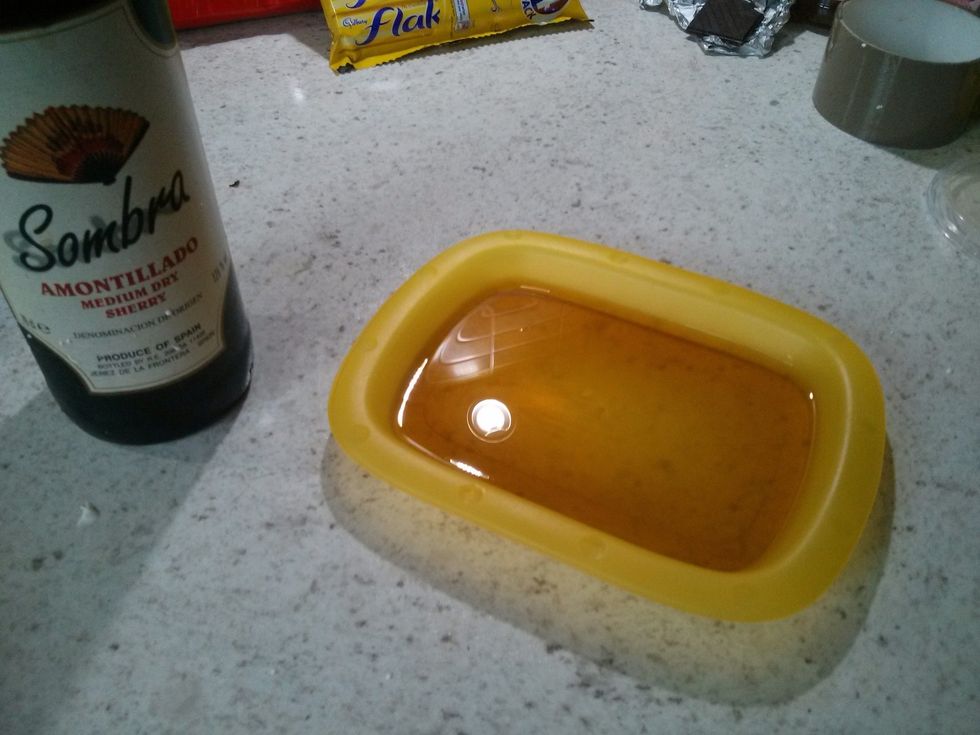 Pour some sherry into a dish. Enough to half immerse a cookie.