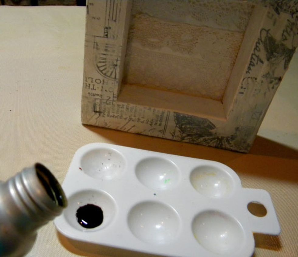 Pour some Warm Colorations Spray into a palette and add a spritz of water.