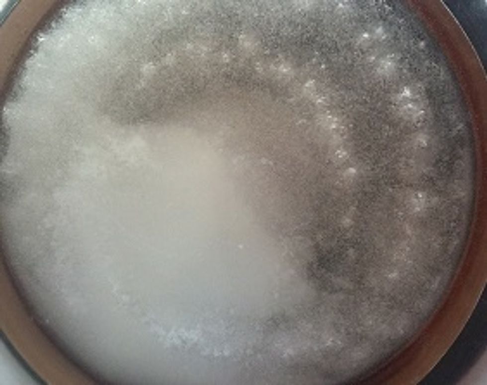 Pour sugar and water into saucepan