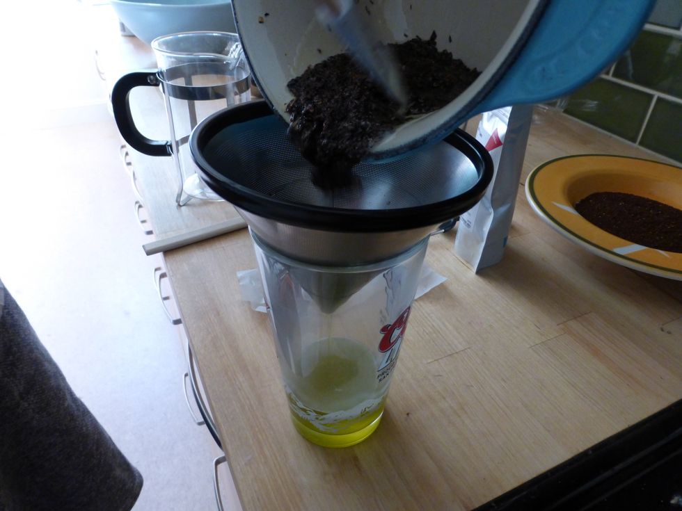Pour Tea & Butter mixture into a glass using a fine sieve. (I used a metal coffee filter in lieu of a sieve; I think you could also use a paper coffee filter)