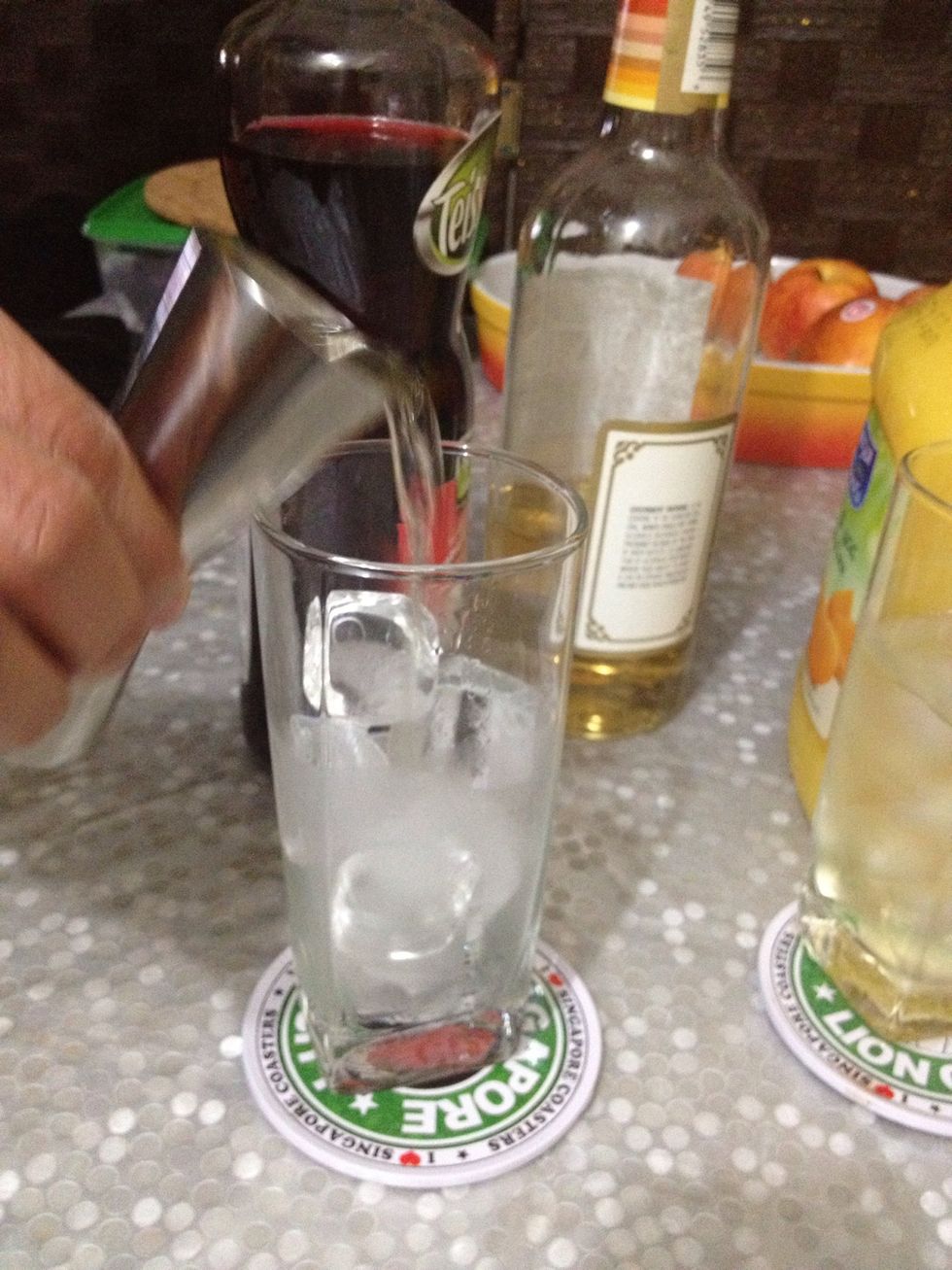pour tequila over ice-filled glass.