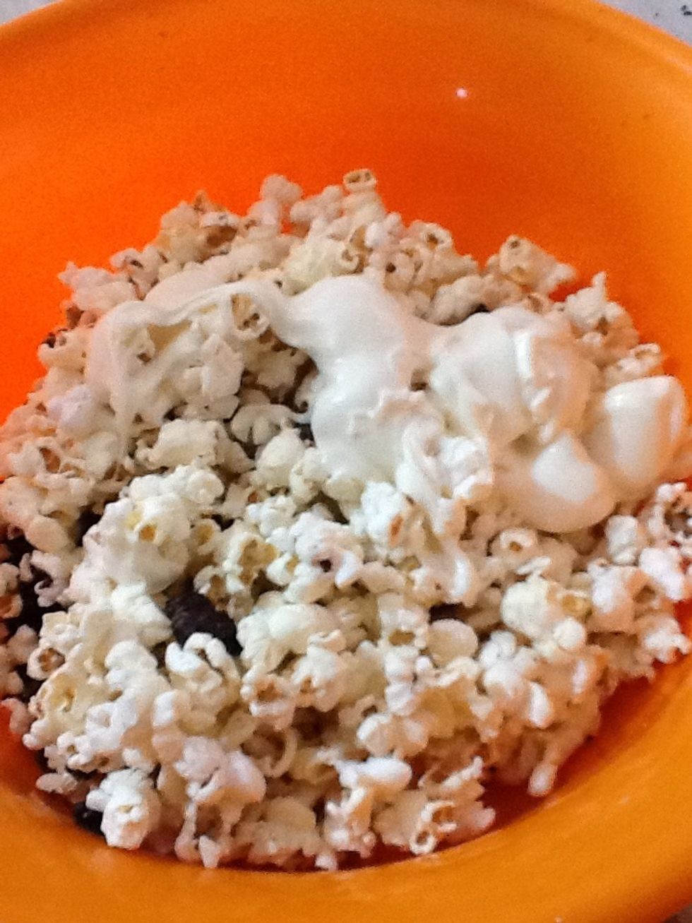 Pour the almond bark on the popcorn