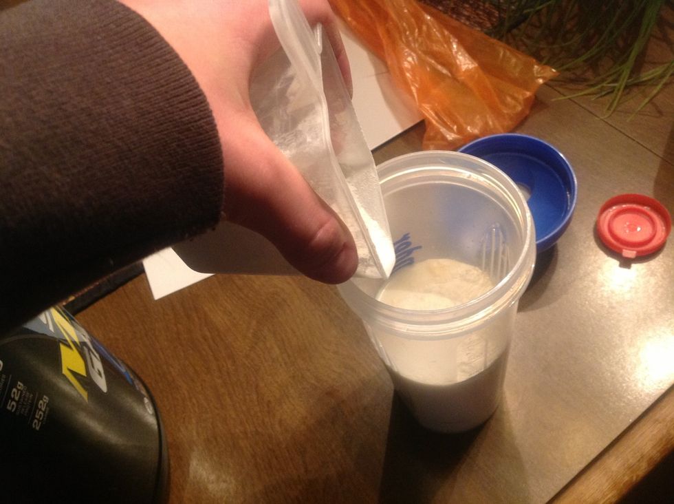 Pour the appropriate amount of protein mix in the cup according to what its container says.