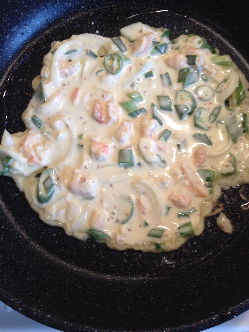 Pour the batter in and swirl the pan to make the batter spread evenly to create the full circle. Make sure you don't put it too much or too little but just enough to make the circle nice and flat