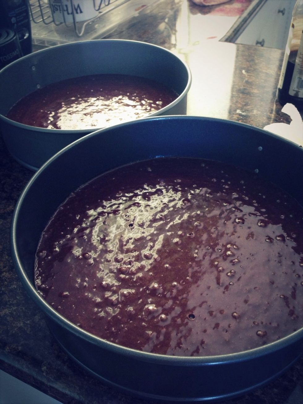 Pour the batter into the prepared pans.