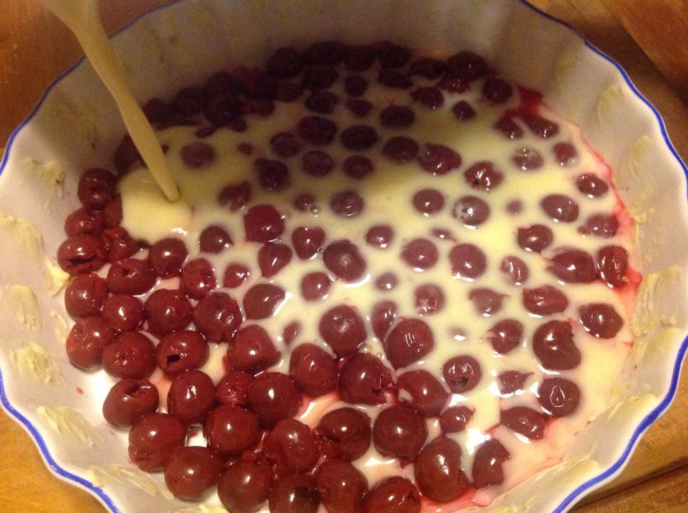 Pour the batter over the cherries evenly.