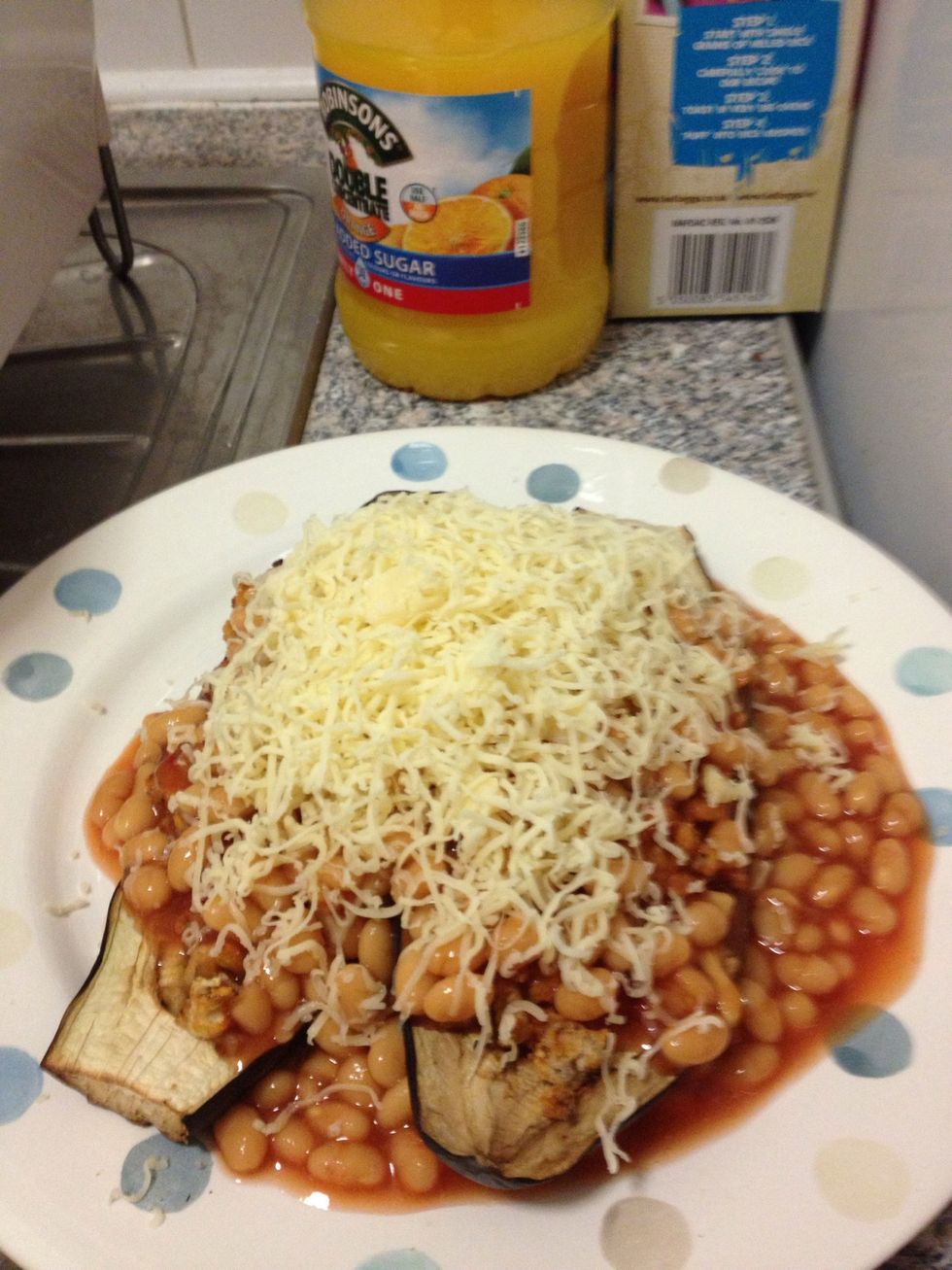Pour the beans over the aubergine and add cheese (I added loads because everybody loves cheese). Enjoy!