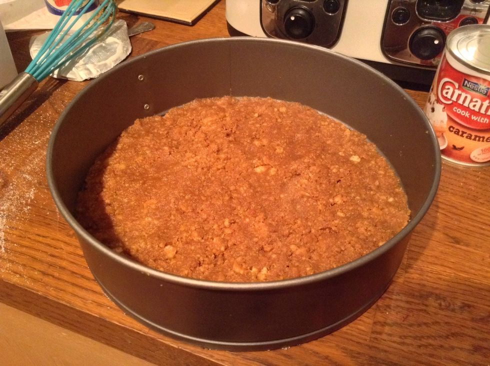 Pour the biscuit mixture into the tin and press down evenly. Make sure you chill the base for 30 mins so it hardens