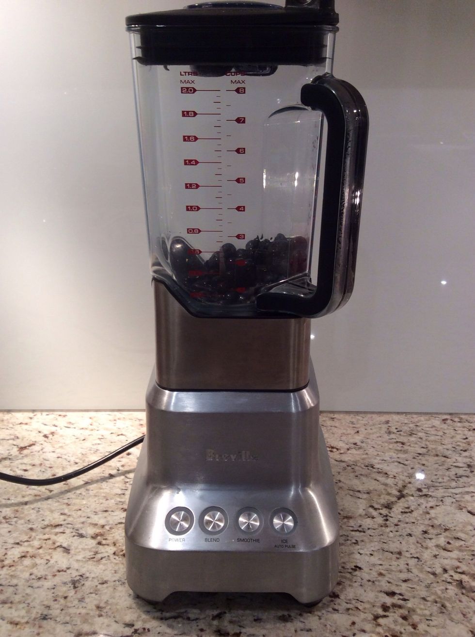 Pour the blueberries and lemon juice into a blender.