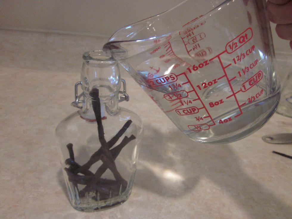 Pour the booze in now. You're all in now. If you stole it from your Dad, make sure to fill the bottle back up with water so you don't get caught. You can thank me later.