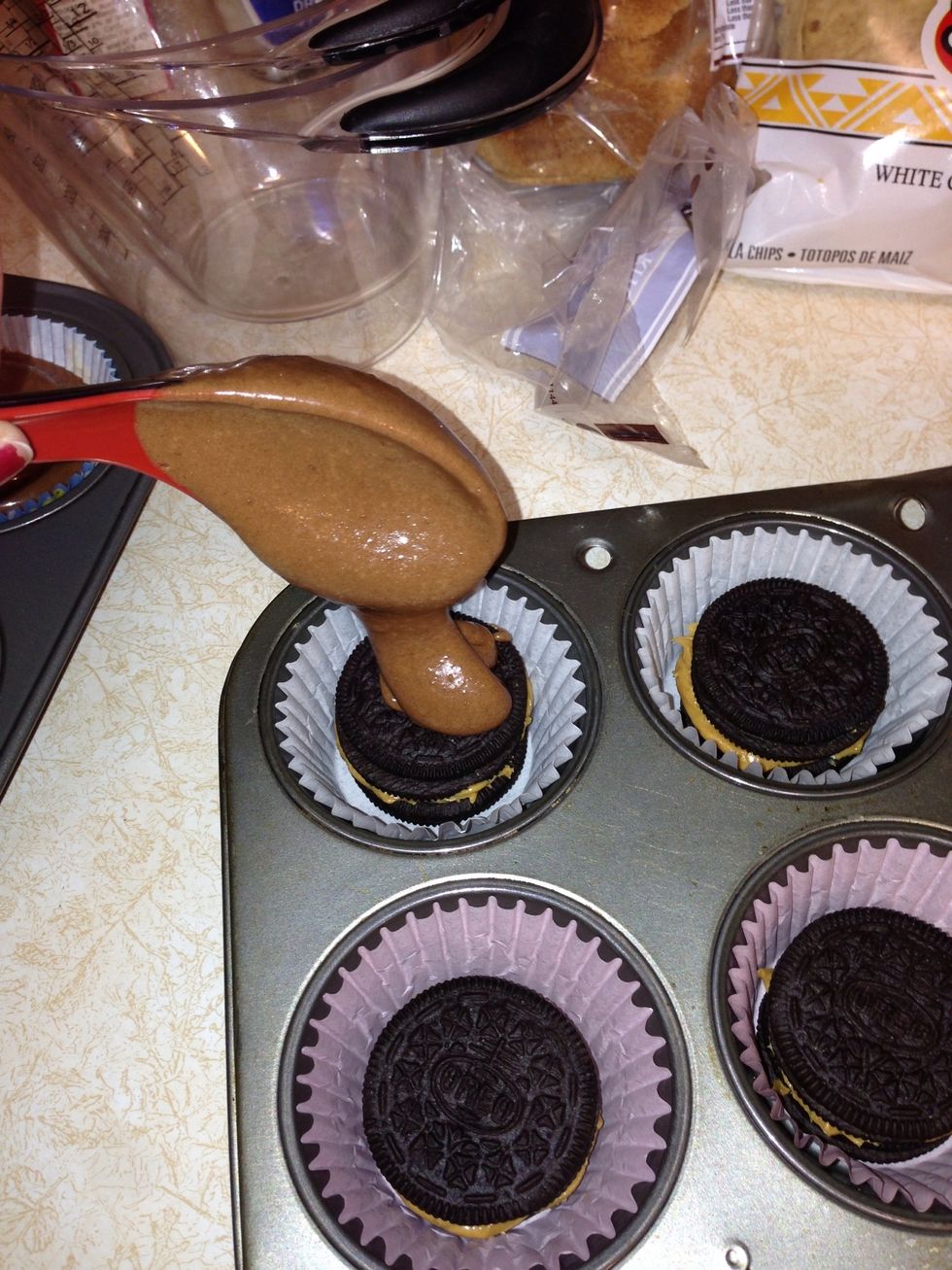 Pour the brownie batter over the Oreos