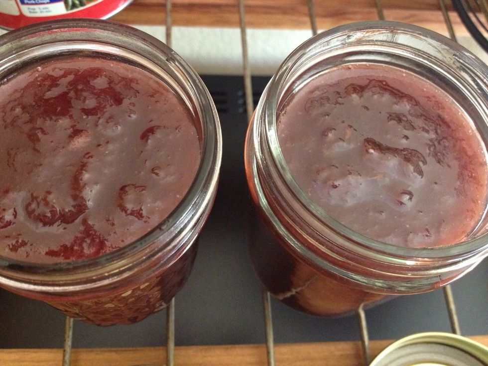 Pour the bubbling hot jam into jars, and don't even think of touching it with your fingers or tongue!!! Cool completely for several hours before closing with the lids.