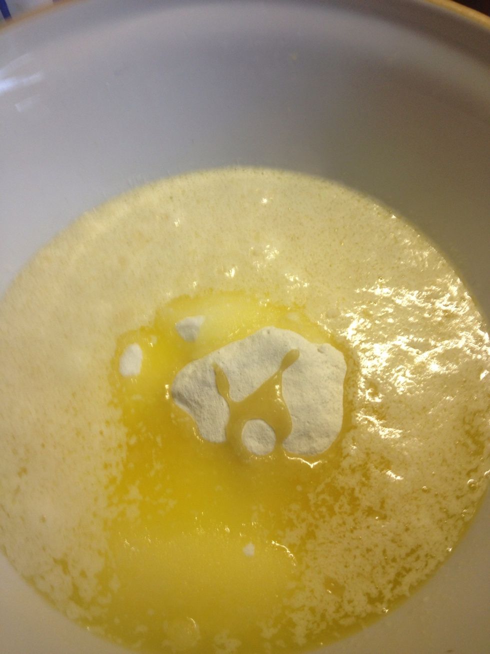 Pour the butter into the mixing bowl with dry ingredients