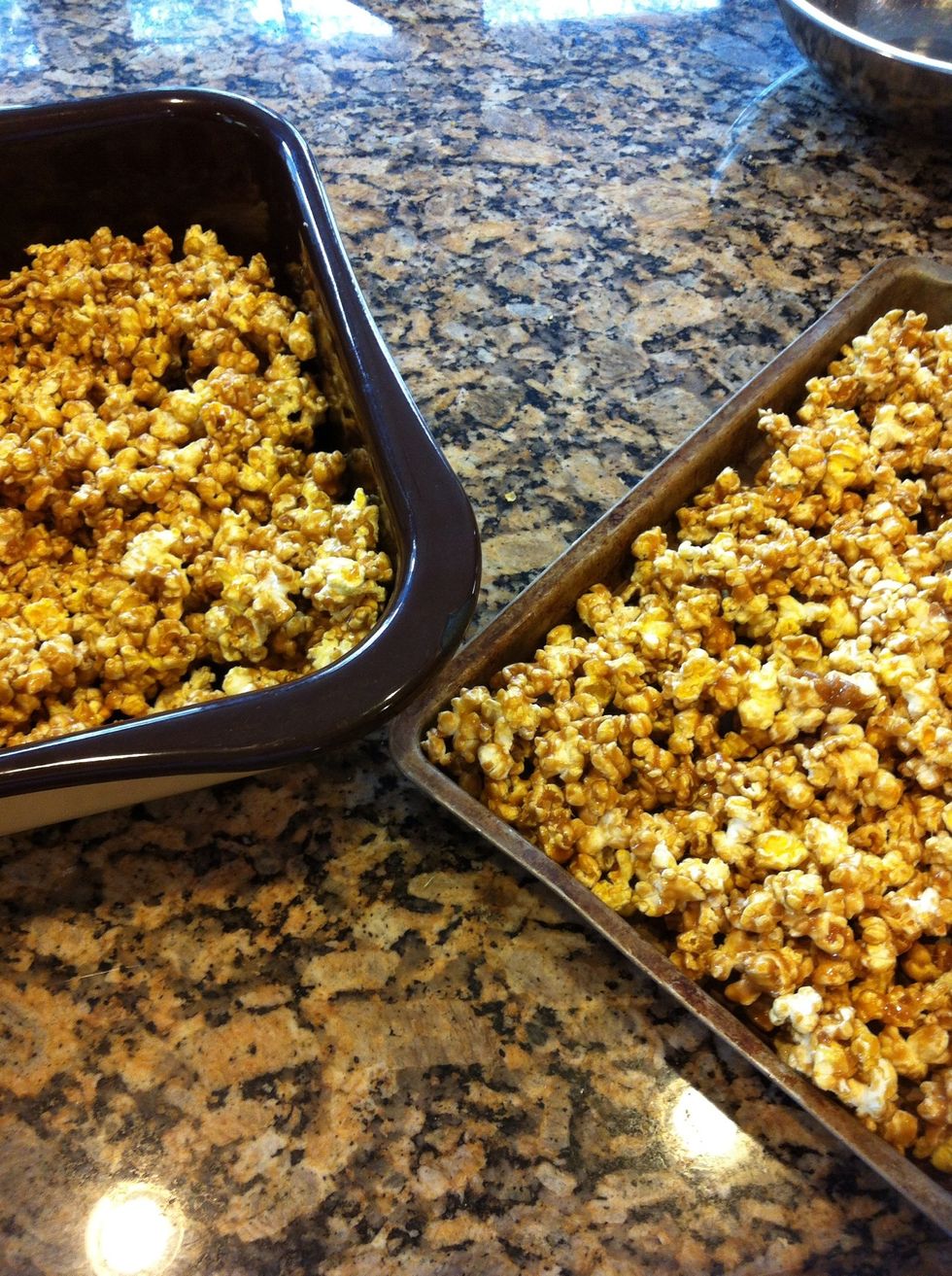 Pour the caramel corn out into two large baking sheets.