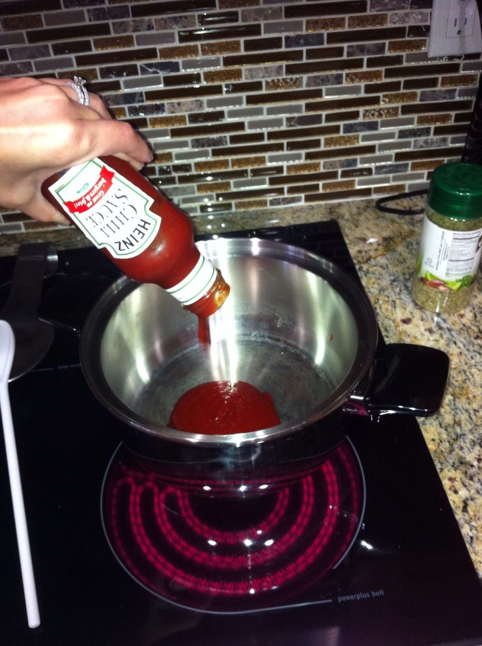 Pour the chili sauce into a large pot on medium heat.