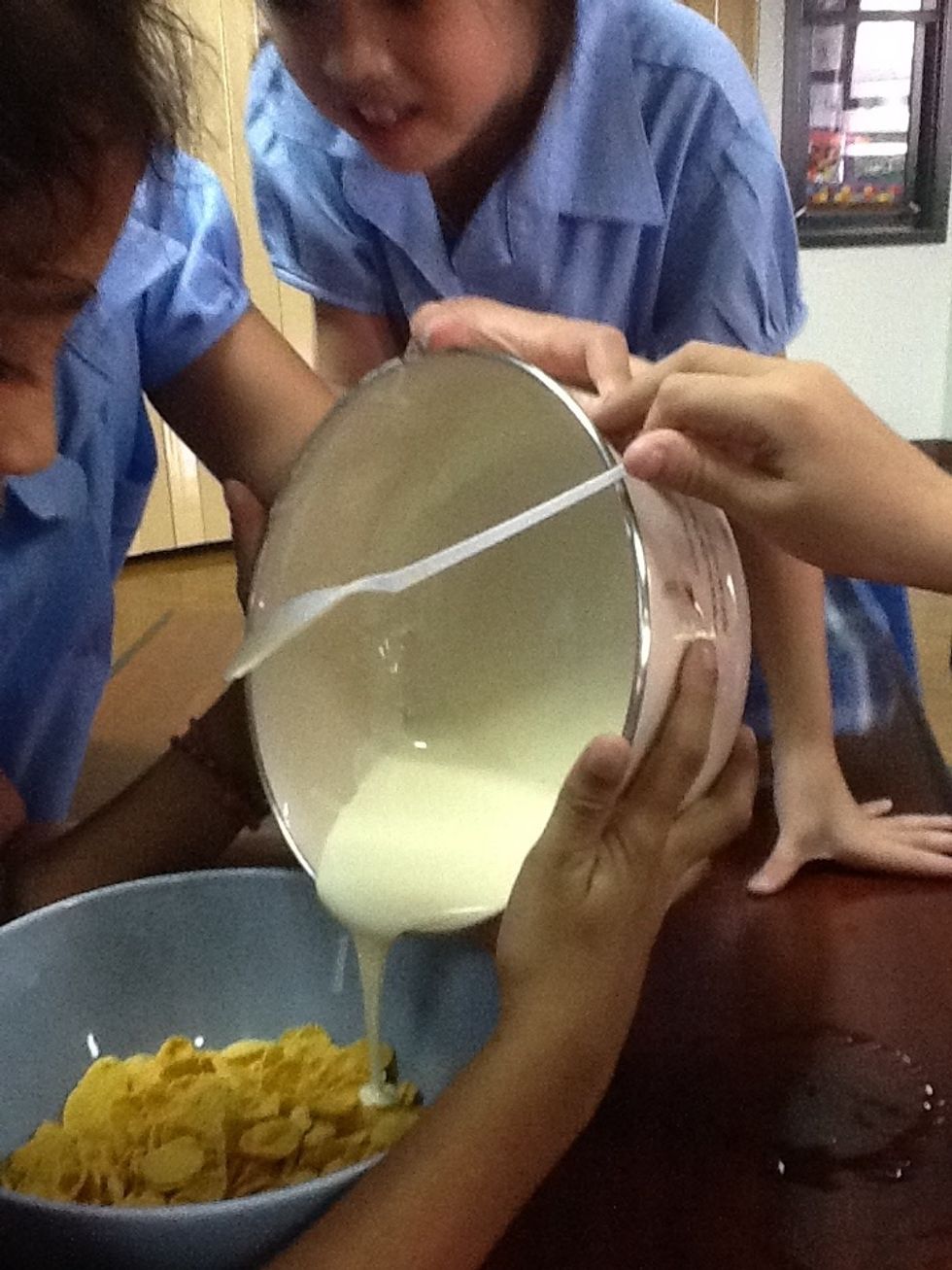 Pour the chocolate into the cornflakes.