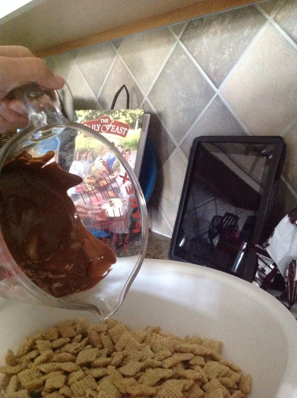 Pour the chocolate into the Rice Chex.