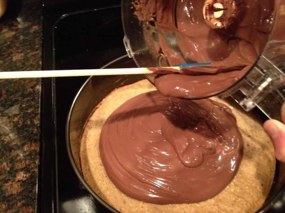 Pour the chocolate mousse over the cookie crust