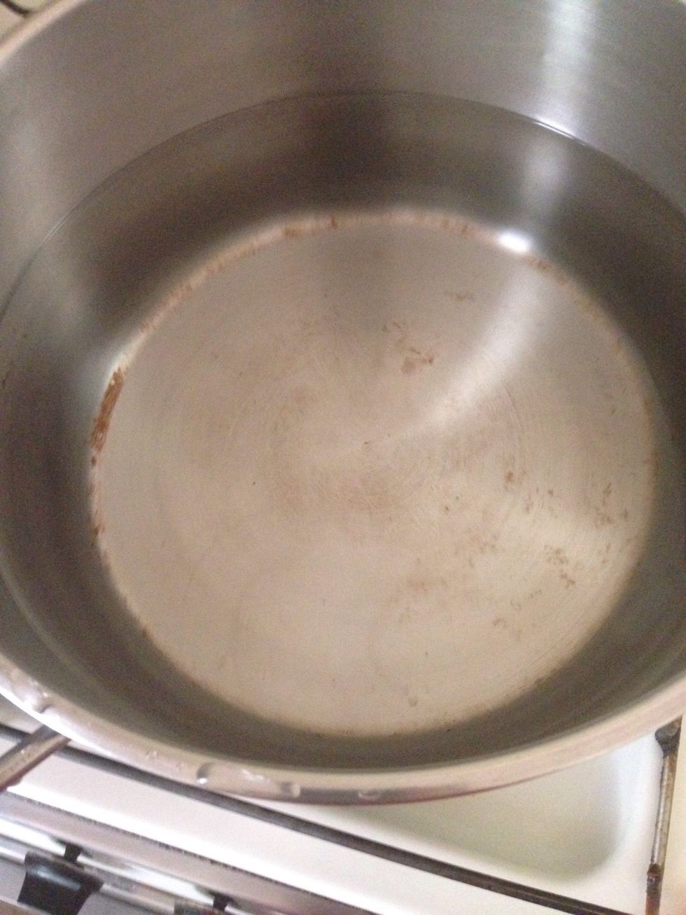 Pour the cold water into a heavy bottom pan and bring to a gentle simmer over a low heat