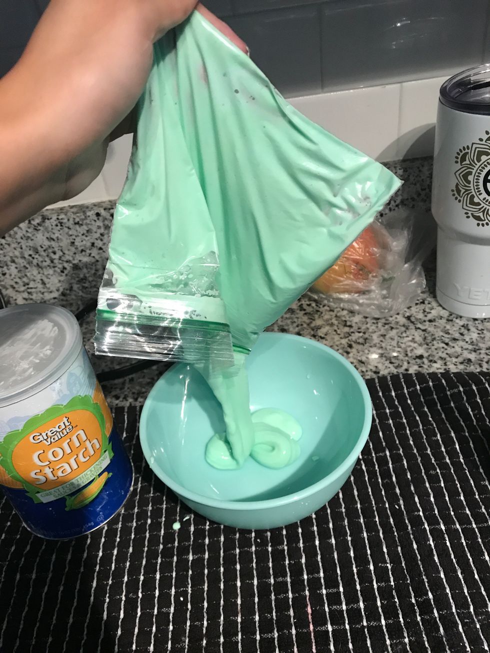 Pour the contents of the ziplock bag into a bowl to test the "oobleck."