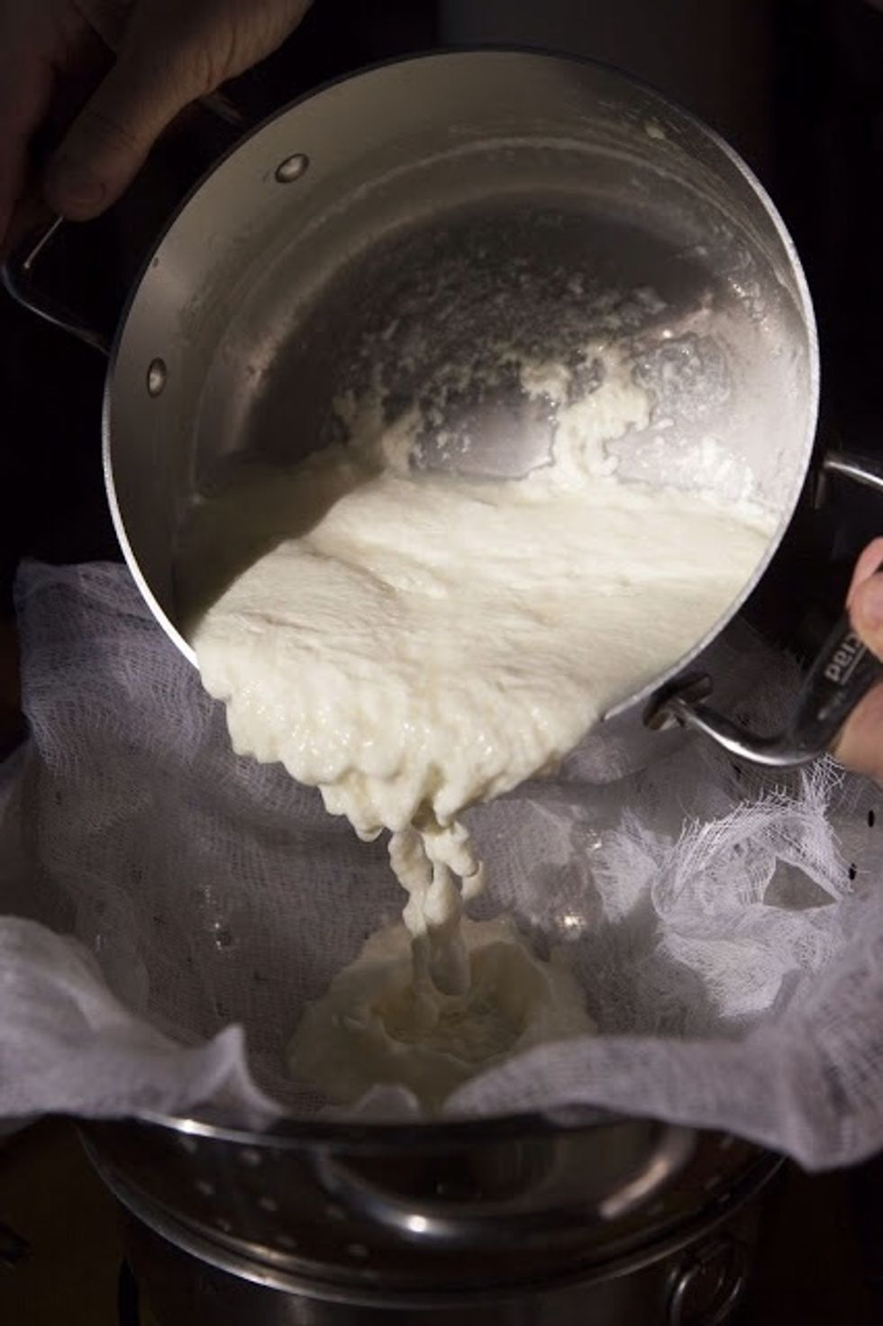 Pour the curds and whey into the cloander.