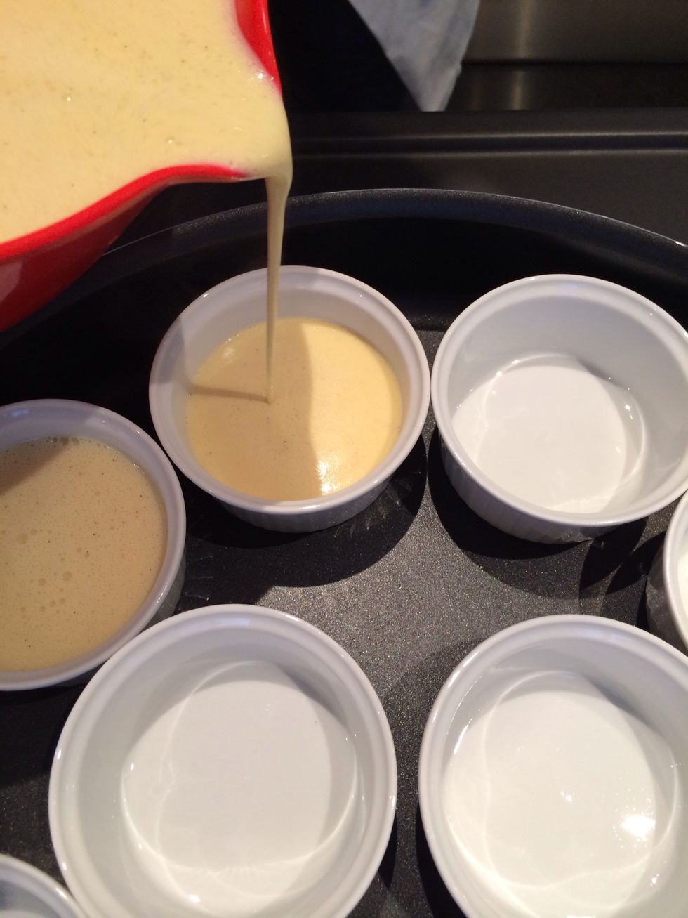Pour the custard in the ramekins.