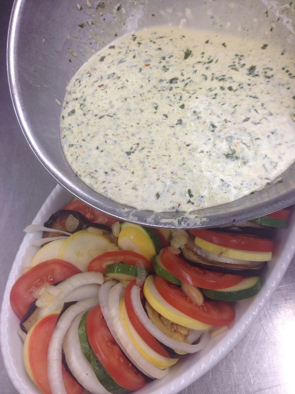 Pour the custard over the veggies.