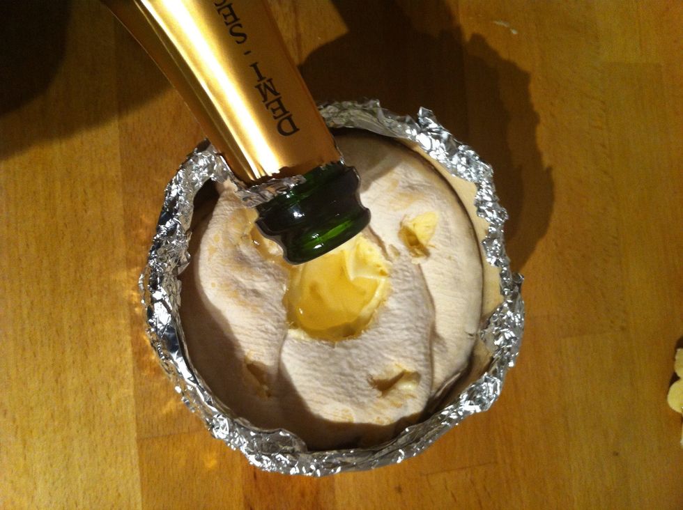 Pour the dry white wine into the hole