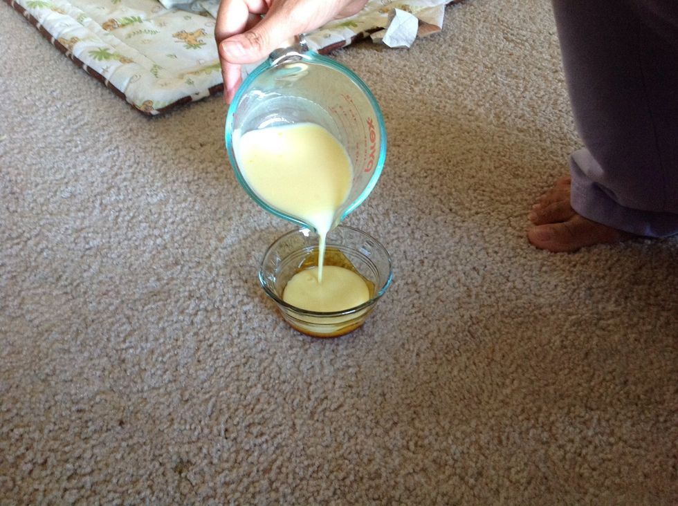 Pour the egg mixture into the caramel lined cups.