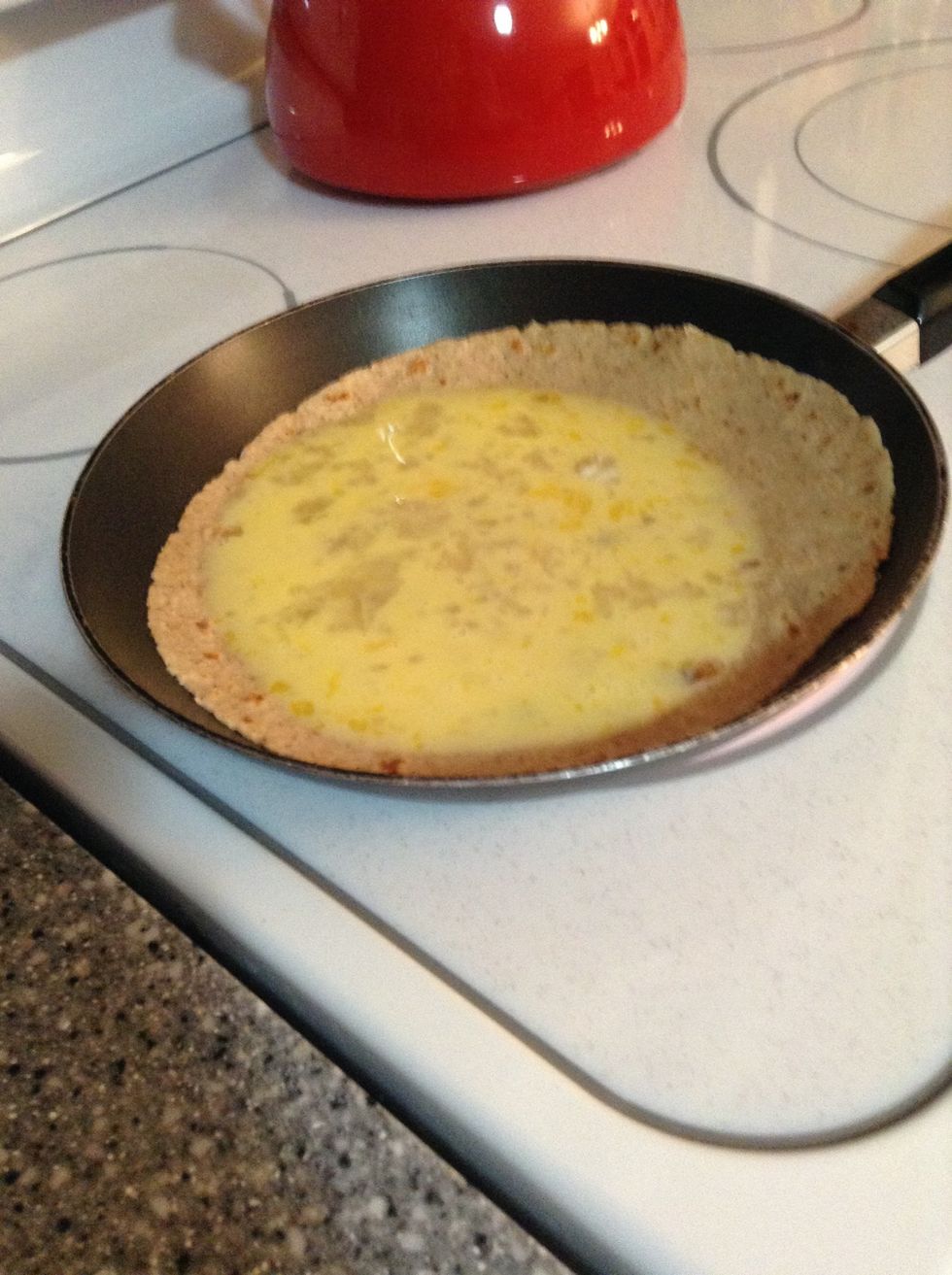 Pour the egg right over top and turn it down to med. heat