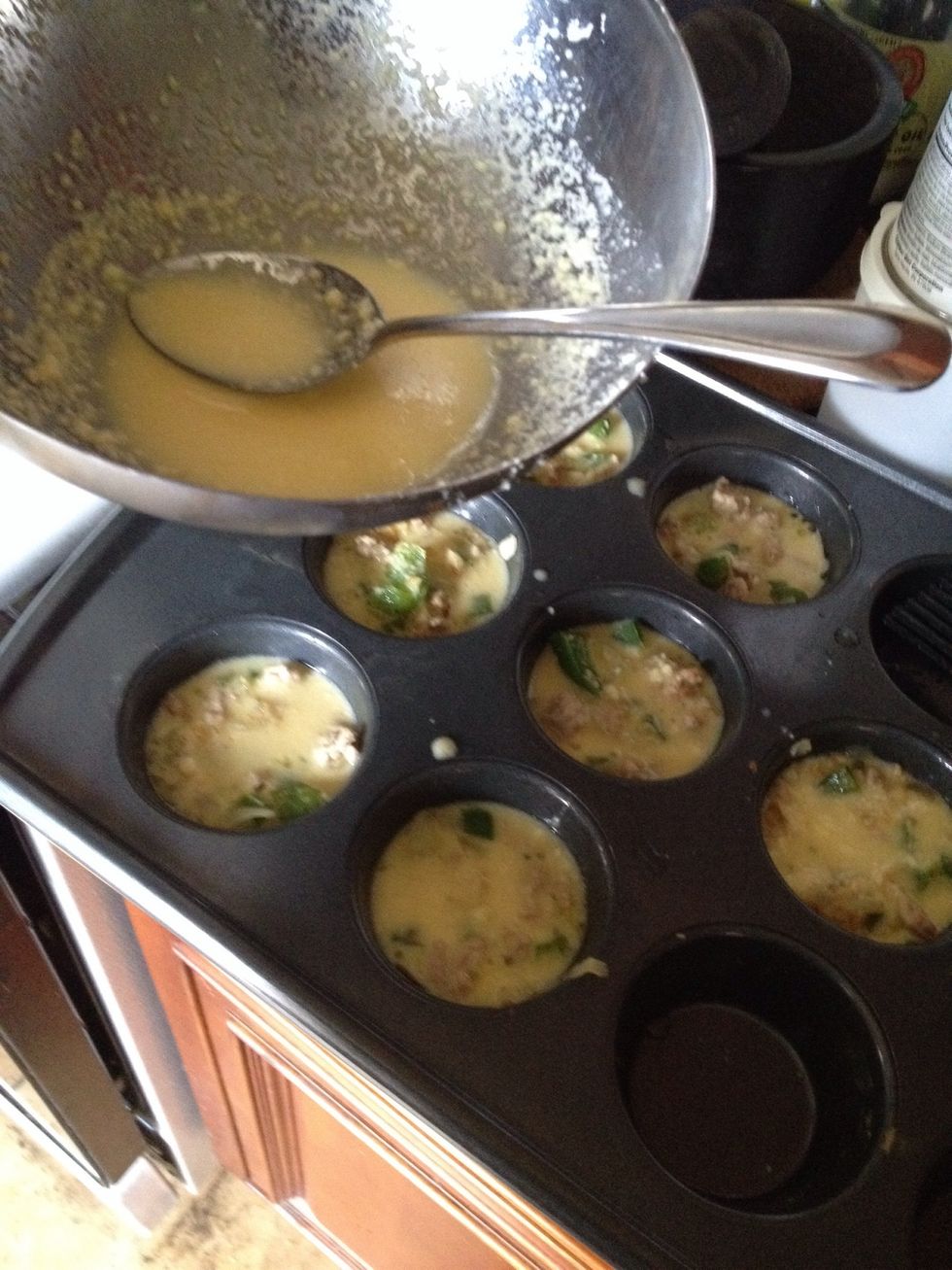 pour the eggs equally among the tins.