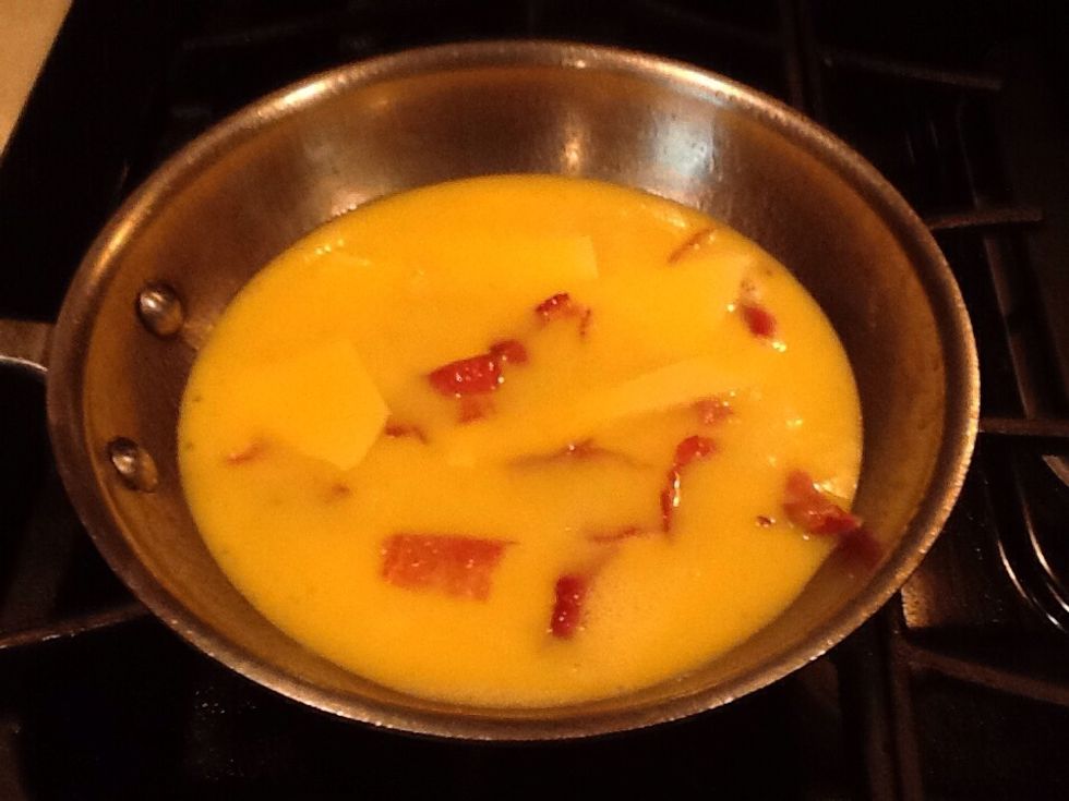 Pour the eggs in to the pan and let it cook.