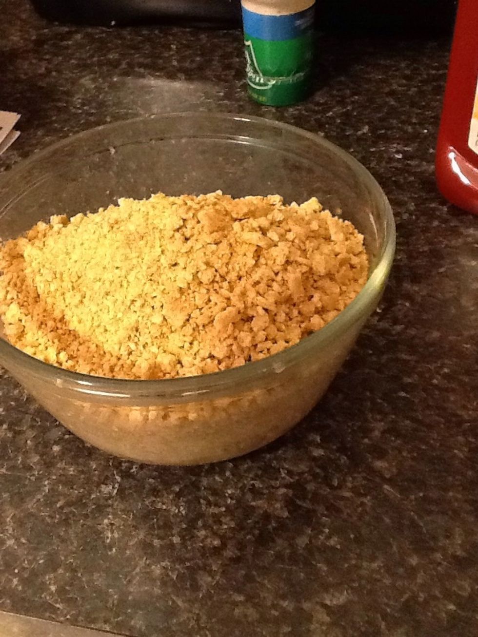 Pour the graham crackers on the melted butter.