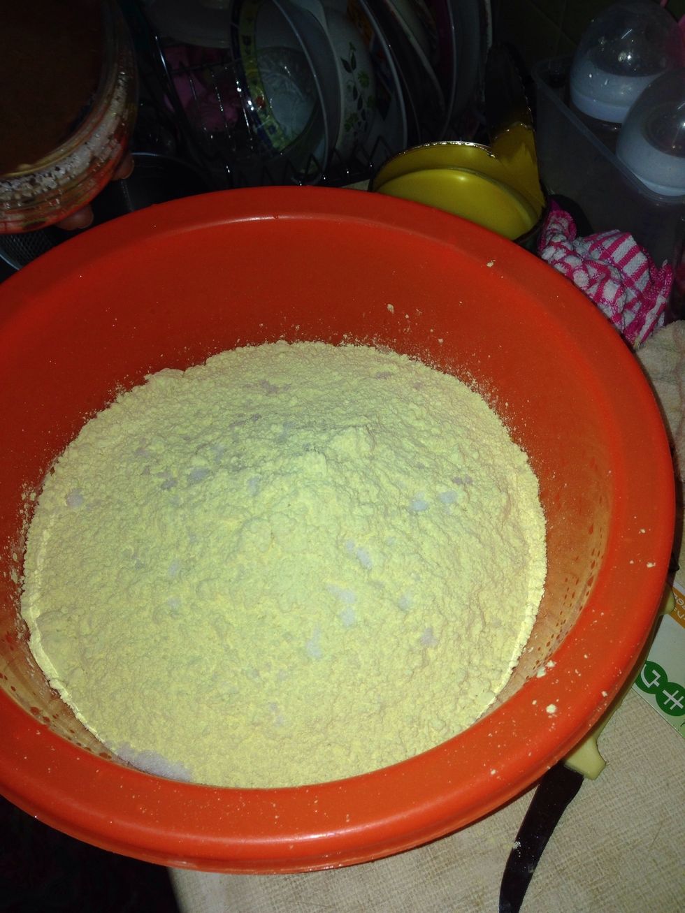 Pour the gram flour into a big mixing bowl.