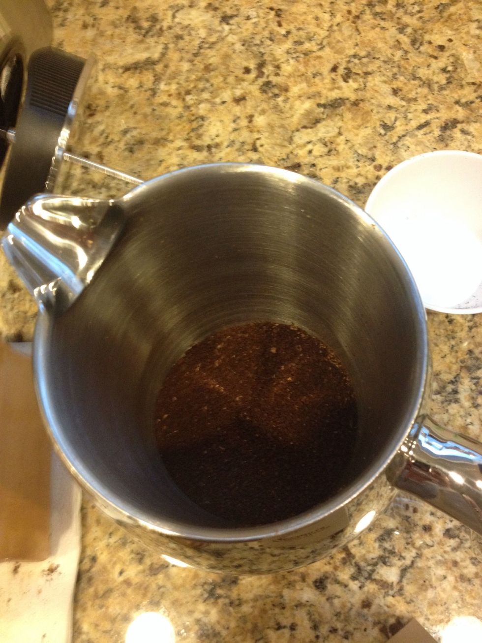 Pour the ground coffee into the bottom of the French Press. Your water should still be coming to a boil at this time.
