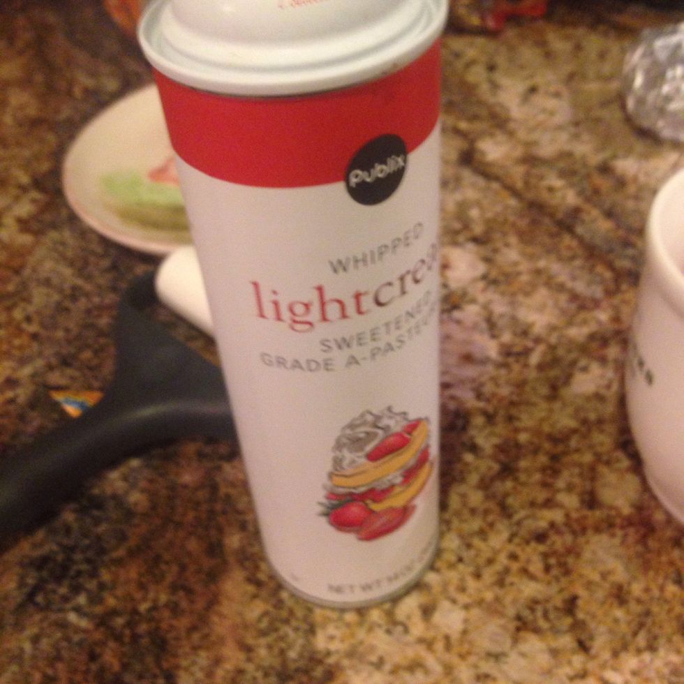 Pour the hot chocolate into the mug and top it off with whipped cream!