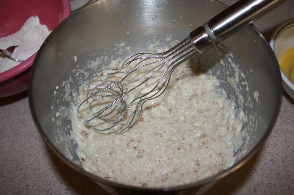 Pour the Hot Milk over the bread. Whisk it together until the bread and milk is combined.
