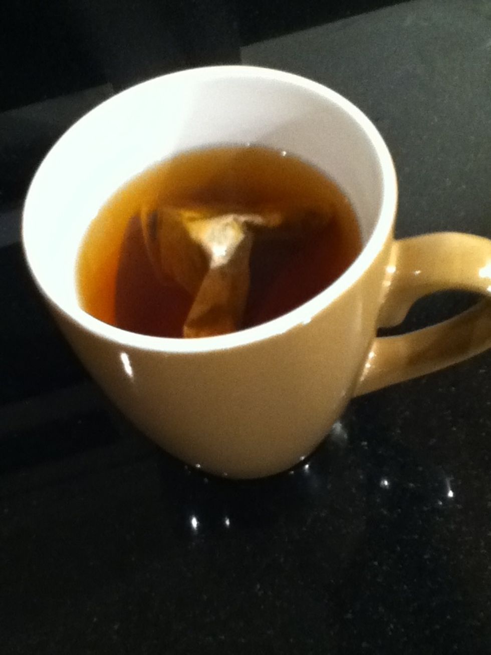Pour the hot water into the cup but leave about an inch of space in between the brim of the cup and the liquid (this will allow room for the milk and to not overflow).