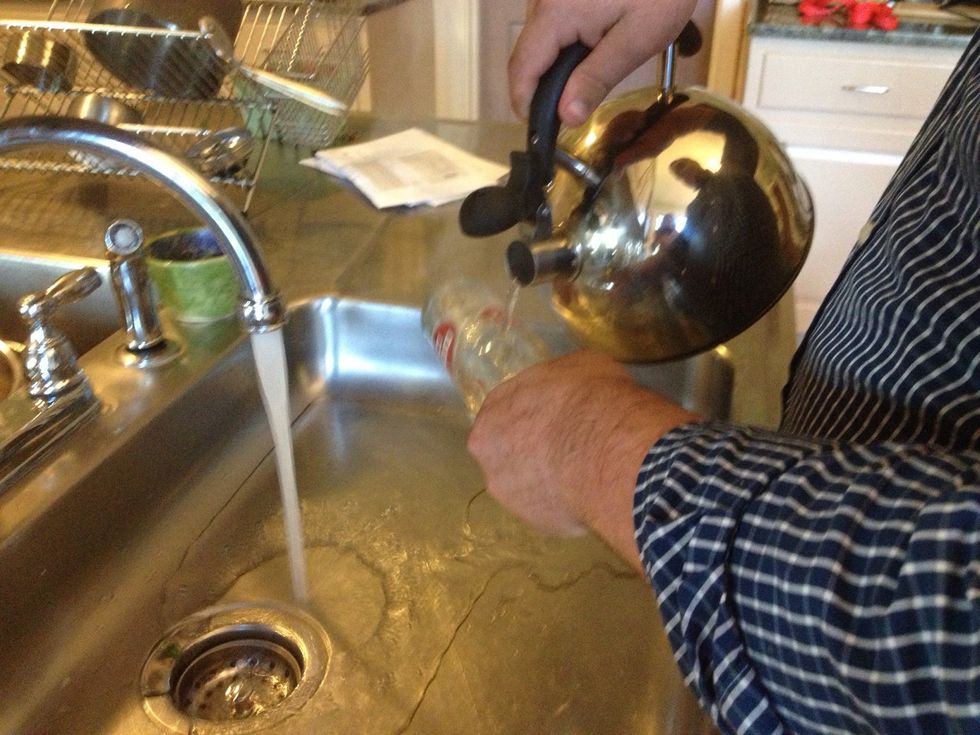 Pour the hot water over the etching you made  in a slow steady stream.