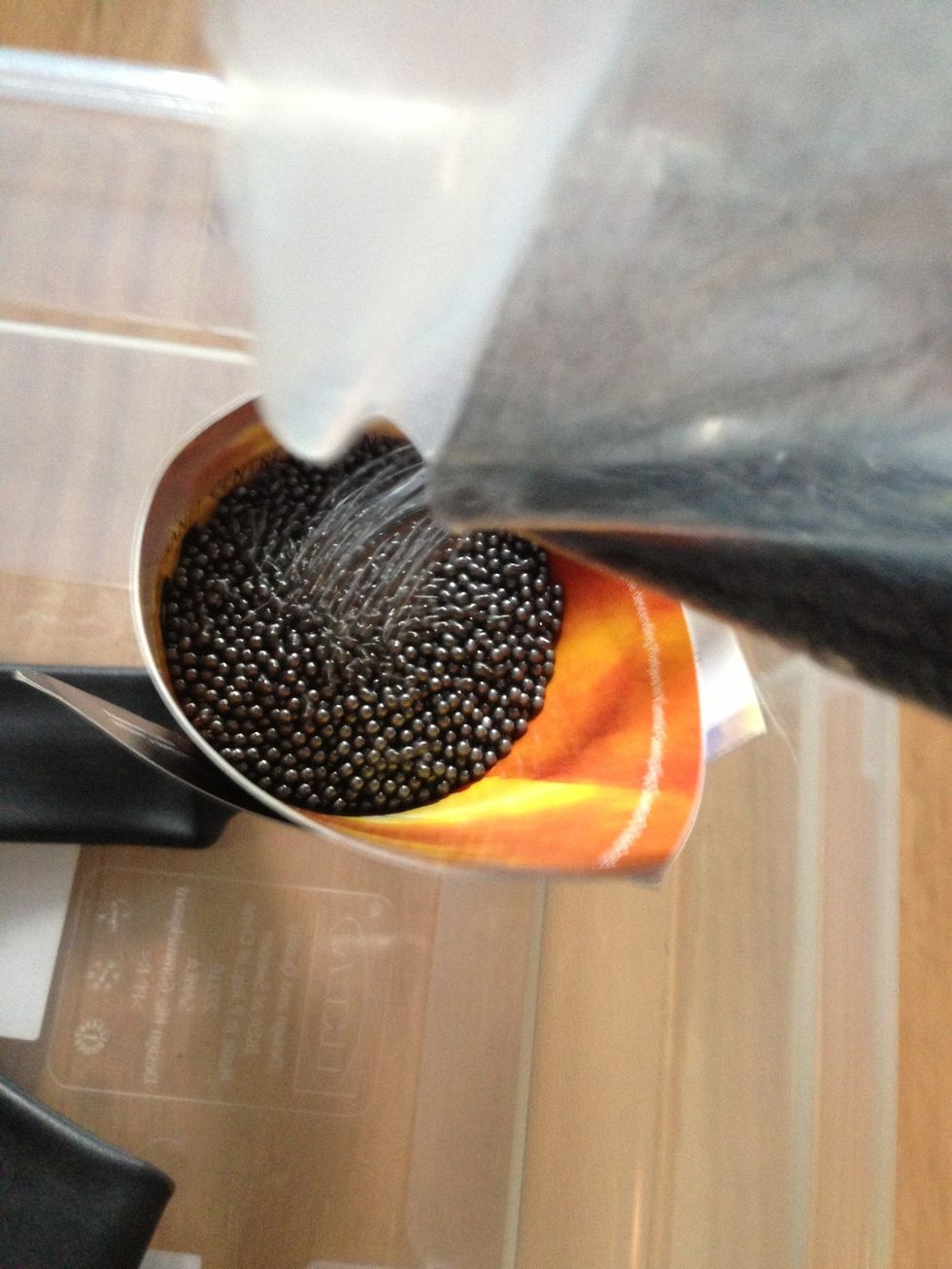 Pour the lead shots to the tube through a funnel, you can use a card wrapped as a funnel.