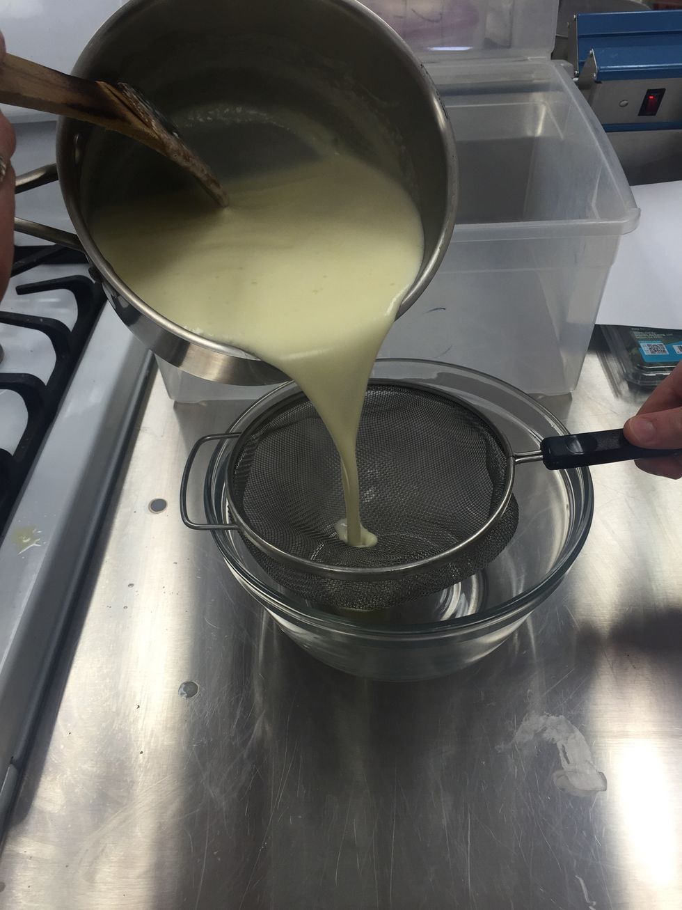 Pour the liquid through a strainer into a bowl.