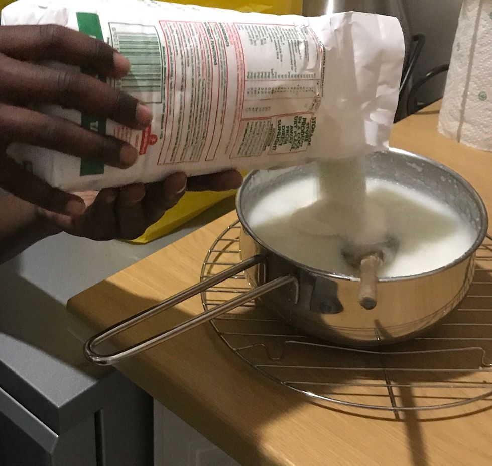 Pour the maize meal in the pot
