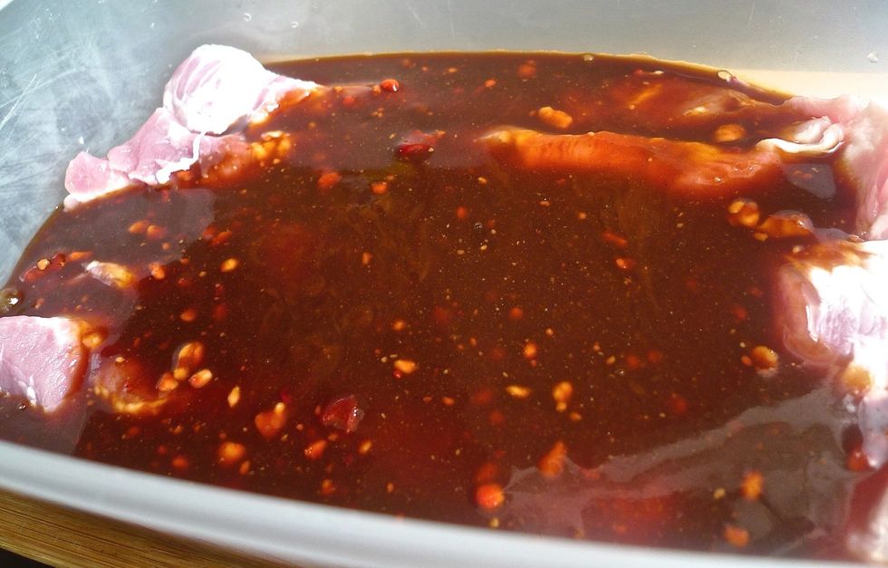 Pour the marinade into the pork in a container. Mix thoroughly so the pork are well coated with the marinade.