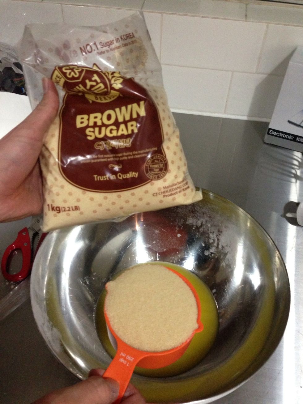 Pour the melted butter, brown sugar and white sugar in a mixing bowl... Using a mixer, beat on medium speed for 2 minutes..